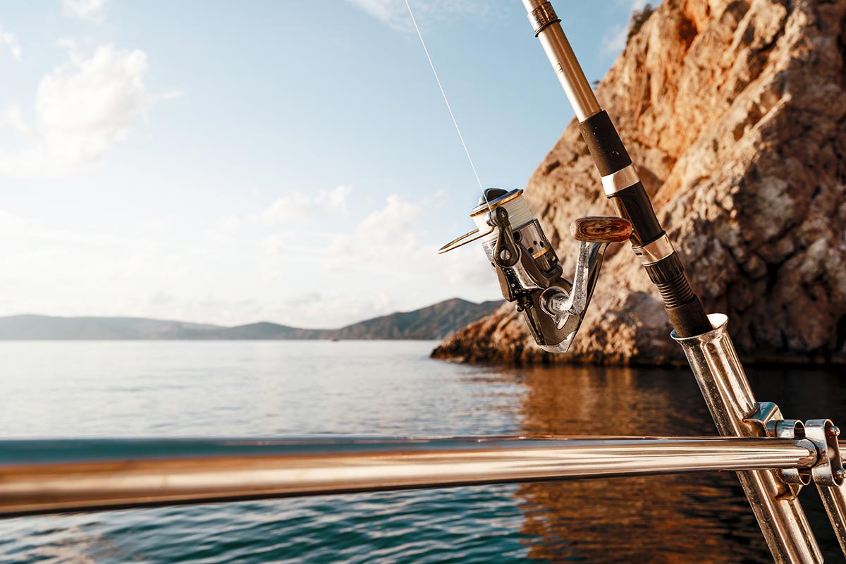 fishing-rod-on-a-sailboat-on-the-background-of-the-2023-11-27-05-12-30-utc
