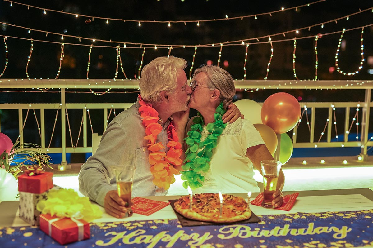 happy-family-couple-kissing-celebrating-birthday-a-2024-11-29-23-34-20-utc